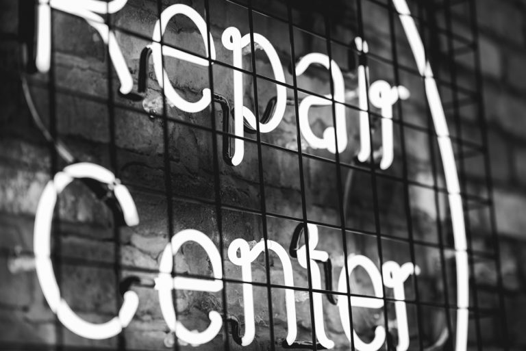 Neon Repair Center Sign Photo by Dana Vollenweider on Unsplash