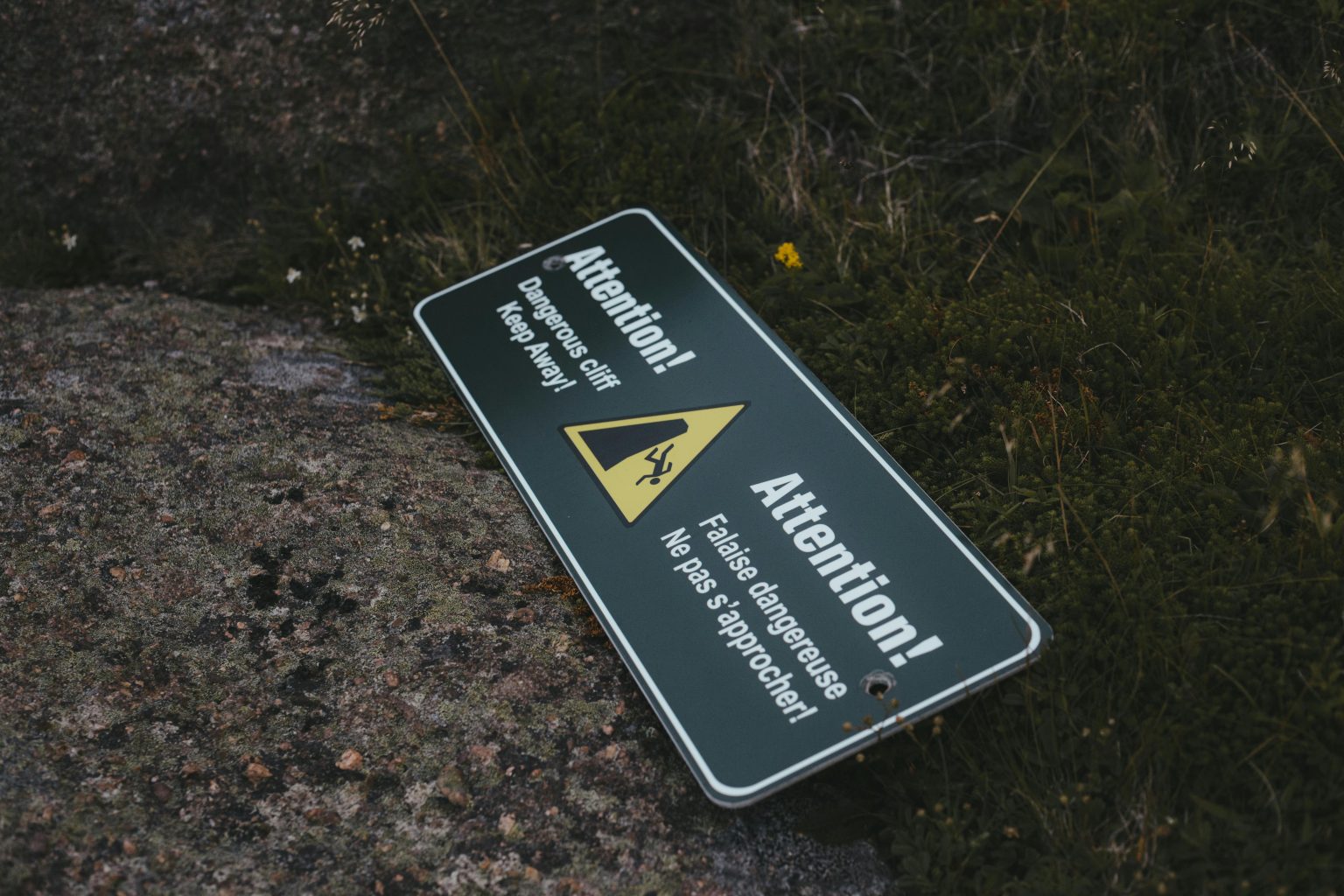 dangerous cliff ahead sign